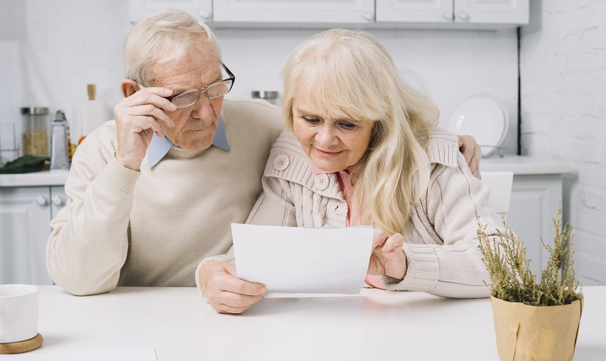 senior-couple-looking-paper.jpg